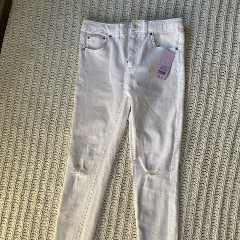 White skinny jeans with fringe bottom